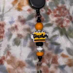 Teacher Badge Reel with Orange and Black Beads